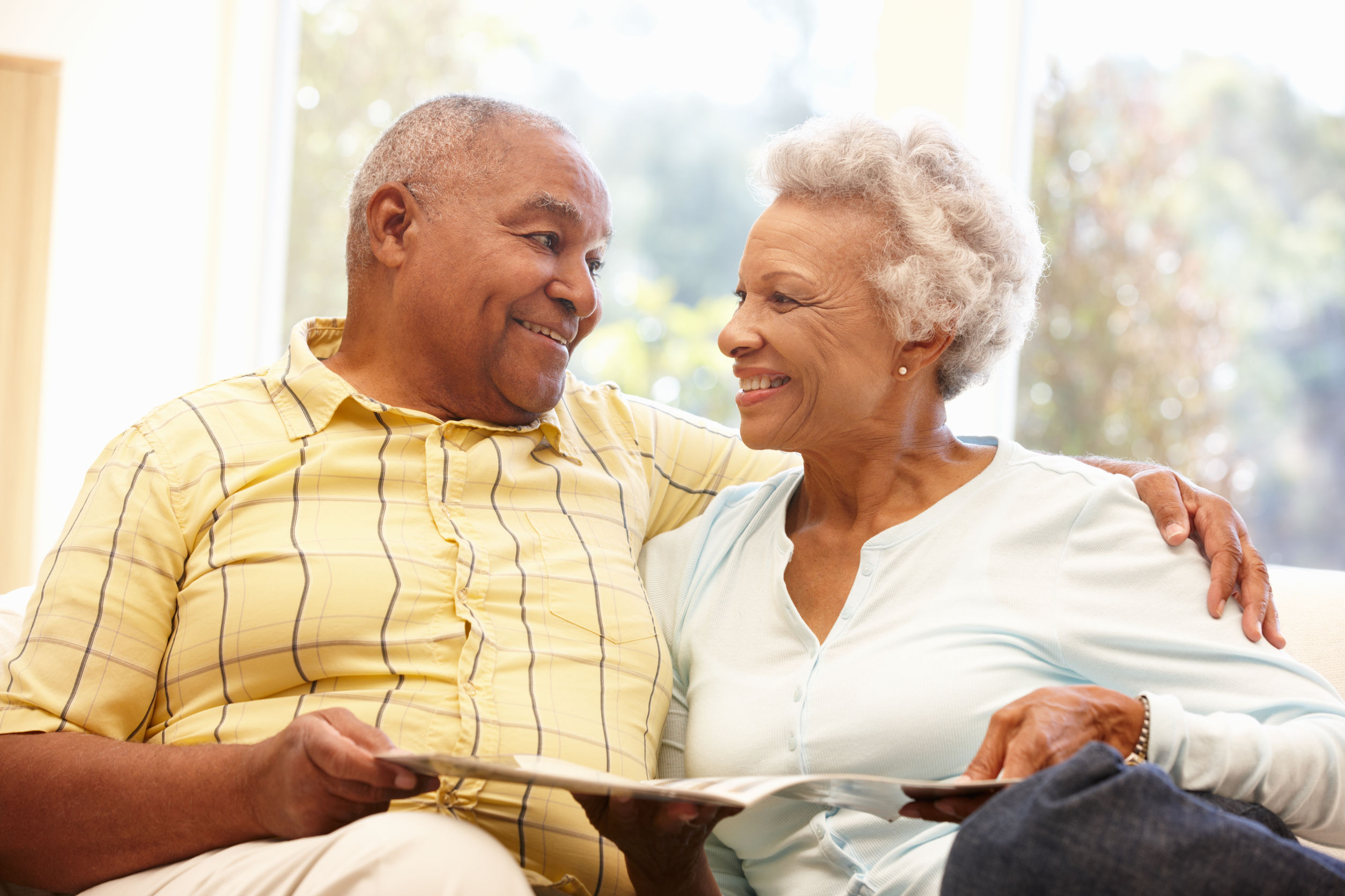 Senior African American couple reading Senior African American couple reading